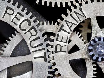 Two cogs with the words,